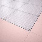Plancher en verre trempé dépoli (Sablé) de 39 mm avec une texture industrielle brute, apportant un caractère unique aux intérieurs de type loft.