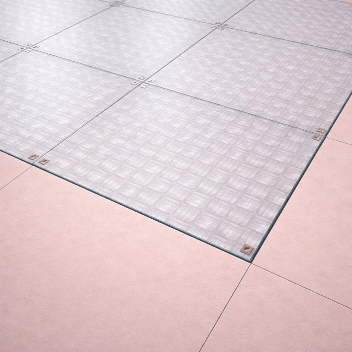 Plancher en verre trempé dépoli (Sablé) de 39 mm avec une texture industrielle brute, apportant un caractère unique aux intérieurs de type loft.