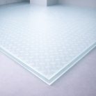 Plancher en verre trempé transparent de 27 mm avec texture elliptique, un motif organique qui ajoute un caractère moderne à tout projet.