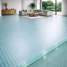 Plancher en verre trempé transparent de 39 mm avec texture de petits cercles, créant d'intéressants jeux d'ombres et de reflets.